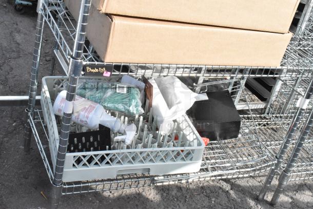 Chrome finish 6-tier wire shelving unit with contents, including cardboard boxes and various items. Buyer must dismantle.