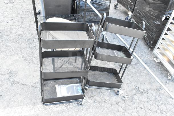 Black rolling cart and shelving unit with multiple tiers. Includes folding chair. Outdoor setting. Good condition.