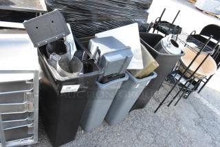 Four poly trash cans with various contents including a keg, plastic pitchers, and trays. Label "246" visible. Auction lot.
