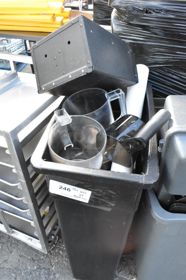 Four poly trash cans containing various items, including a keg, with visible auction label "246." Good condition.