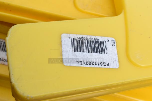 Five yellow poly wet floor caution signs with barcode label visible, slight wear indicated. Ideal for safety use.