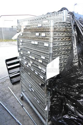 Chrome finish 25-tier wire shelving unit with commercial casters, disassembled. Buyer must dismantle for shipping.