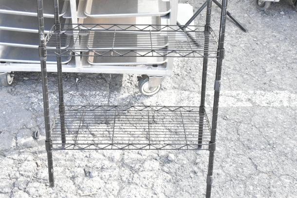 Black 6-tier wire shelving unit, sturdy construction, black finish, good condition, requires dismantling for shipping.