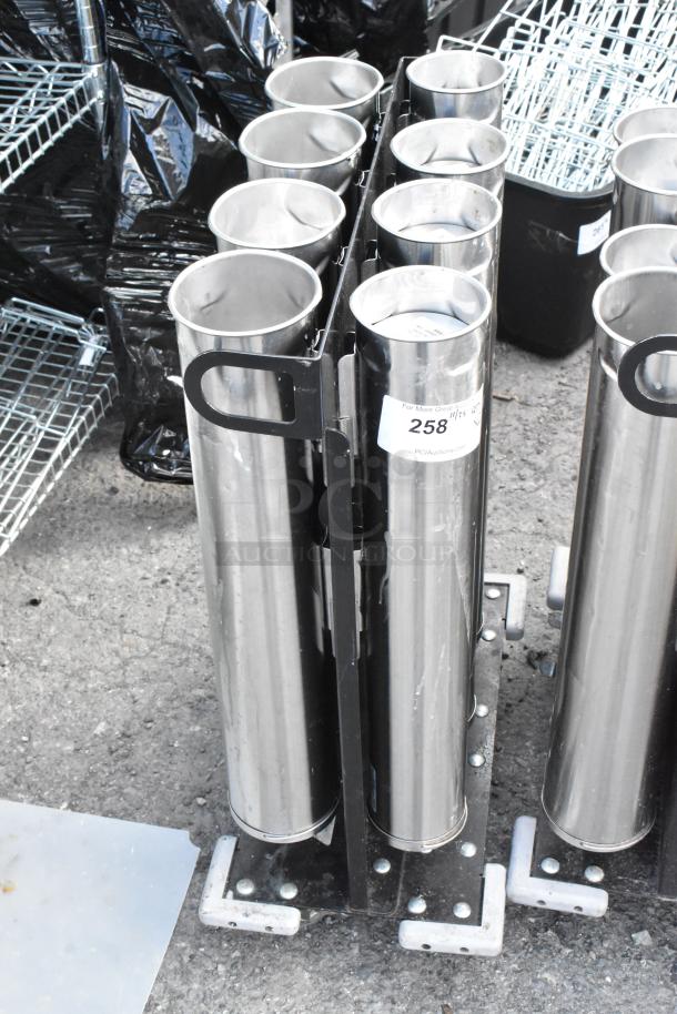 Two metal carts with eight stainless steel cup dispensers each, in used condition, featuring a marked label with "258."