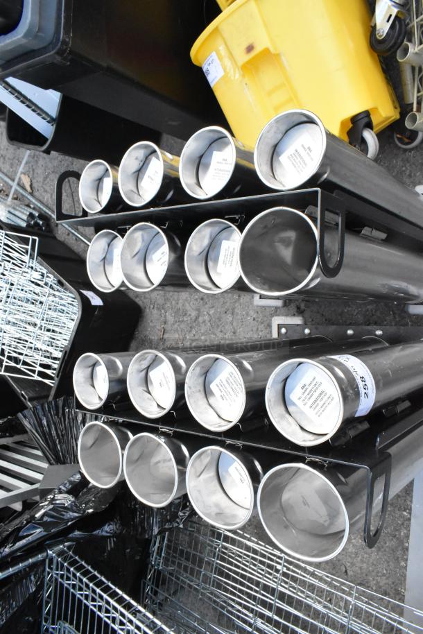 Two metal carts with eight cup dispensers each, in good condition. Labels visible, indicating item tags for auction identification.