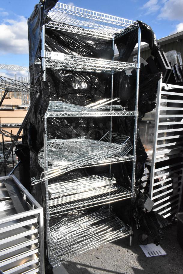 Chrome finish 6-tier wire shelving unit with assorted contents, partially dismantled, fair condition. Requires buyer disassembly.