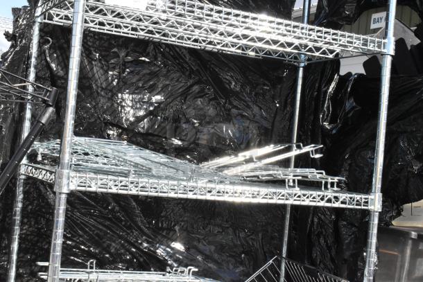 Chrome finish 6-tier wire shelving unit with contents. Requires dismantling by buyer. Consider freight charges.