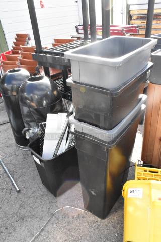 Five poly trash cans, including four Slim Jims. Black and grey, varying sizes. Visible wear, ideal for commercial use.