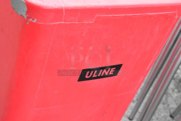 Red Poly Slim Jim Trash Can by Uline, minor wear visible on the surface, durable design, suitable for commercial use.