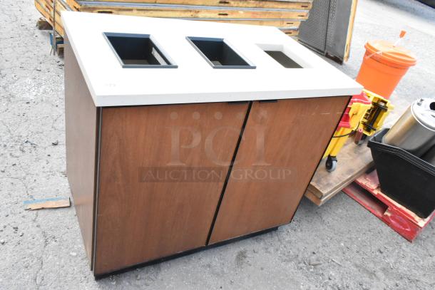 Wood pattern trash can shell with three deposit holes, dual doors, and white top. Some visible wear, suitable for commercial use.