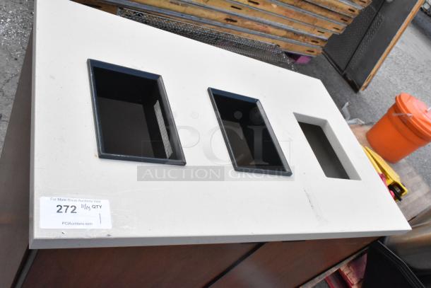 Wood pattern trash can shell with three deposit holes, used condition. Auction tag reads "272 11/25 QTY".