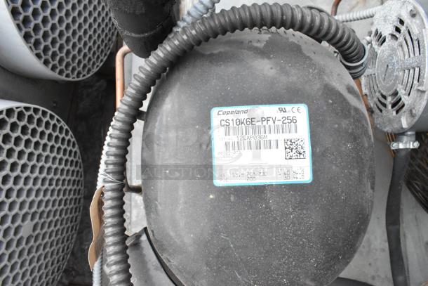 Copeland compressor model CS10K6E-PFV-256, 208-230V, 1 phase, serial 12EAP036M, attached wiring visible.
