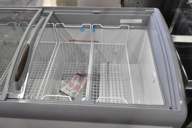 Brand new KoolMore MCF-16C ice cream freezer, scratch and dent, slide glass doors, two wire baskets, 115V, 1 Phase.