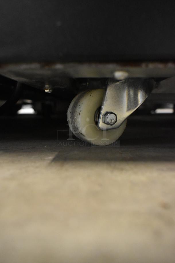 Brand new Avantco 193BCFD36B black bakery display case caster. Durable, steel-mounted wheel on a commercial caster.