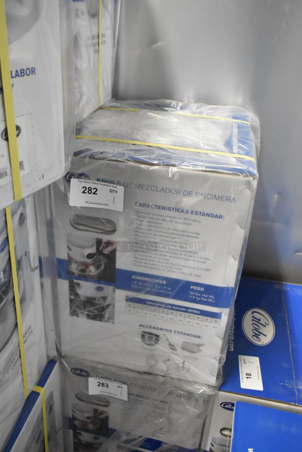 Brand new Globe SP05 5 Quart Metal Countertop Planetary Dough Mixer in box, 115V, 1 Phase, with specs and accessories listed.