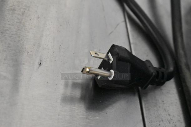 Close-up of a power plug for the Avantco 177IC3500 Induction Range, displaying minor surface scratches.