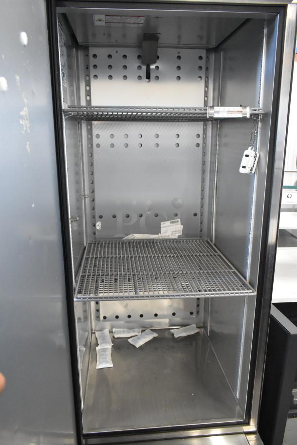 2022 True T-23F-HC stainless steel commercial freezer with poly-coated racks, single door, 115V, 1 phase, excellent condition.