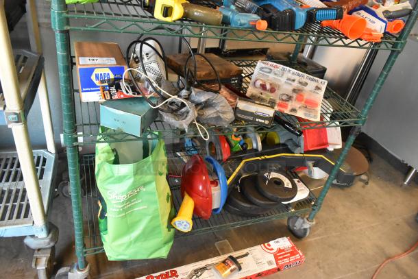 Two-tier lot including fishing lures, windchimes, and Nintendo Switch controller holder, displayed on a green metal shelf.