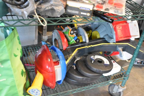 Two-tier cart with assorted items: fishing lures pack, windchimes, Nintendo Switch controller holder, weights, and various toys.
