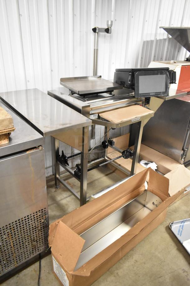 Hobart HWS-4C metal hand wrap station with hot plate and label printing scale. 120 volts, 1 phase. Features Hobart branding.