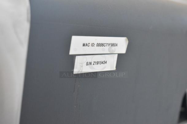 Hobart AW-4600 commercial heat shrink wrap station with visible MAC ID: 0006C71F980A and serial number Z1915434.