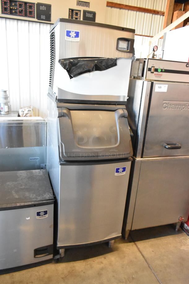 Brand new 2024 Manitowoc IDT0420A-161 Indigo NXT ice machine on bin, 470 lb., 115V, 1 phase, minor dents visible.