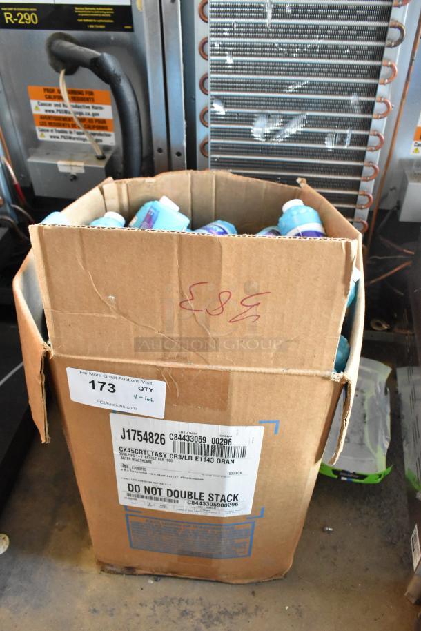 Cardboard box of various items including Fom Concentrate and Bubble Gun. Box marked with handling labels and auction info.