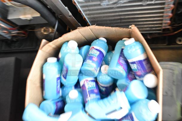 Lot of Fom Mania concentrate bottles in a box, includes a bubble gun. New condition, various items for sale.