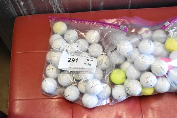 Lot of mixed golf balls, including TaylorMade and Callaway, in two sealed bags. Good condition, varying colors and markings, tag labeled "291".