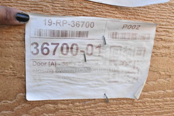 Brand new walk-in door, 36"x84", model 19-RP-36700, slight cosmetic defects. Tag displays size and model details.