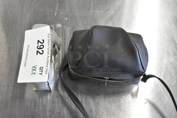 Halina 1:5.6 film camera in black case and Honeywell Tilt-a-mite gauge with auction tag, lot 292, 2 items.