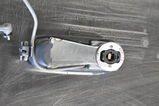 Honeywell Tilt-a-mite Gauge, silver with textured finish, showing brand and model markings, in good condition.