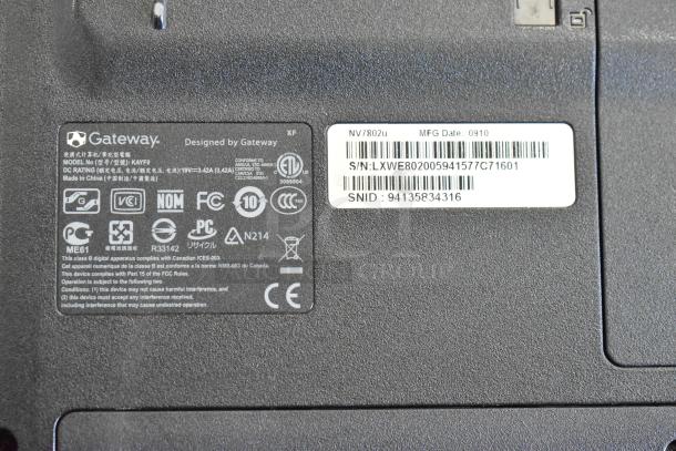 Gateway KAYF0 laptop base showing product labels, model number, specifications, and safety compliance icons.