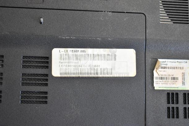 Reconditioned Gateway KAYF0 laptop bottom view showing product label and Windows 7 Home Premium sticker.