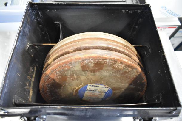 Hard case containing Humble Film Library films. Rusted film reels are visible, with labels indicating titles and catalog details.