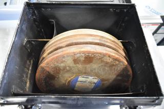 Hard case containing Humble Film Library films. Rusted film reels are visible, with labels indicating titles and catalog details.