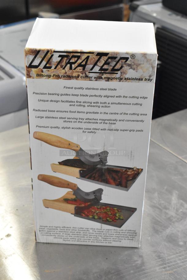 Ultra Tec Optic RV2990 radiused cutter with magnetic stainless tray. Features precision stainless steel blade, non-slip wooden base.