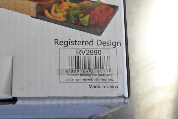 Ultratec RV2990 Radiused Cutter box, registered design, barcode visible, includes magnetic stainless tray, made in China.