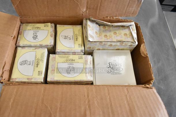6 Precious Moments figurines in original boxes, featuring clowns and "Winter's Song." Excellent condition, Enesco brand.