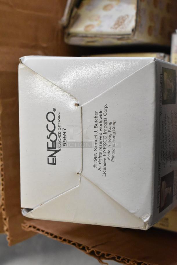 6 Precious Moments figurines in original Enesco box, featuring clowns and "Winters Song." Excellent condition, item #5697.