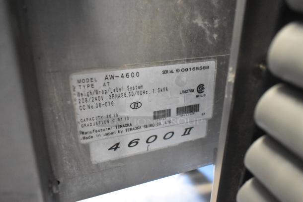 Hobart AW-4600 metal heat shrink wrap station label. Shows model, voltage, and manufacturer details.