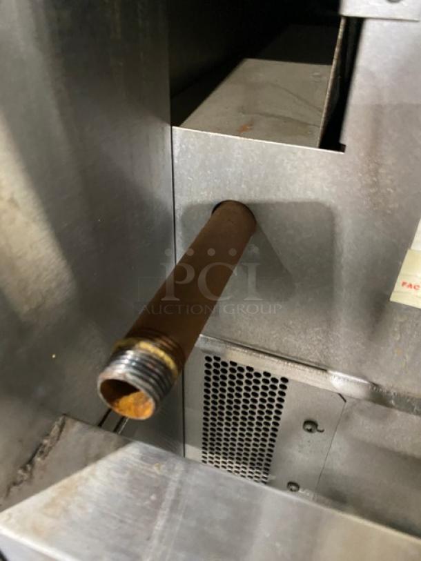 Blodgett stainless steel convection oven close-up of natural gas connector, showing a pipe extending from the unit.