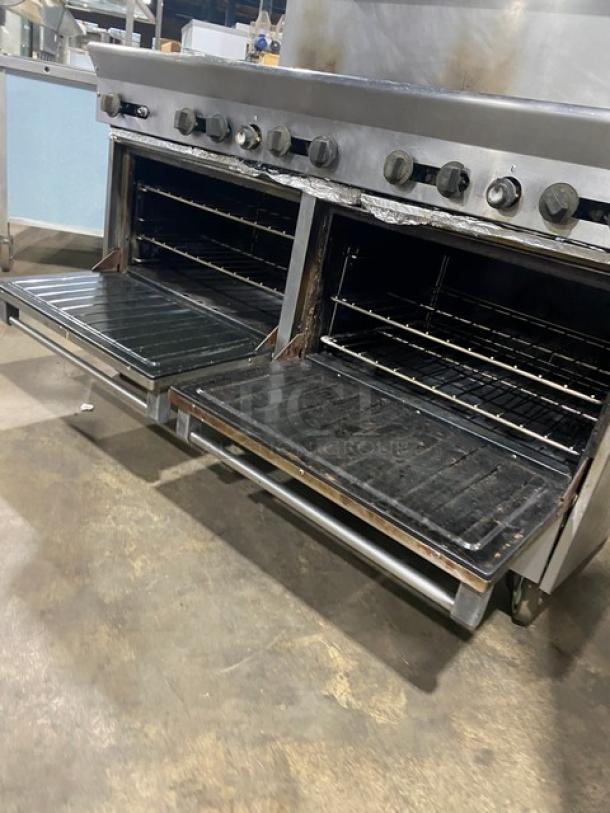 U.S. Range commercial 10 burner gas range with double oven, stainless steel, wired racks, backsplash, salamander shelf, on casters.