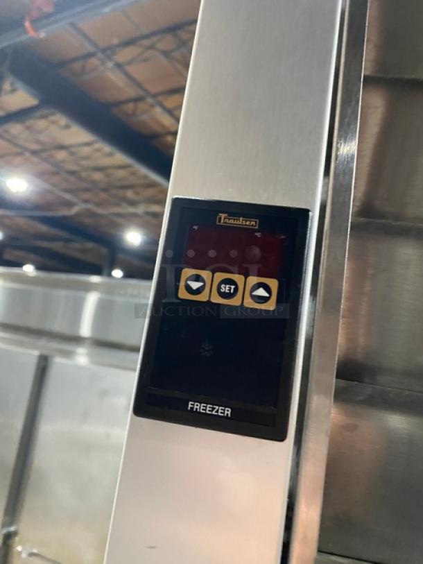 Traulsen G31010 commercial stainless steel triple door freezer, digital control panel, solid doors, on casters. Model G31010.