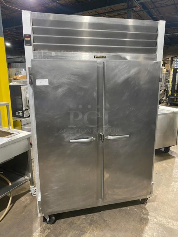Traulsen stainless steel 2-door commercial refrigerator, model G20010, with poly coated wired racks, on casters. Energy Star certified.