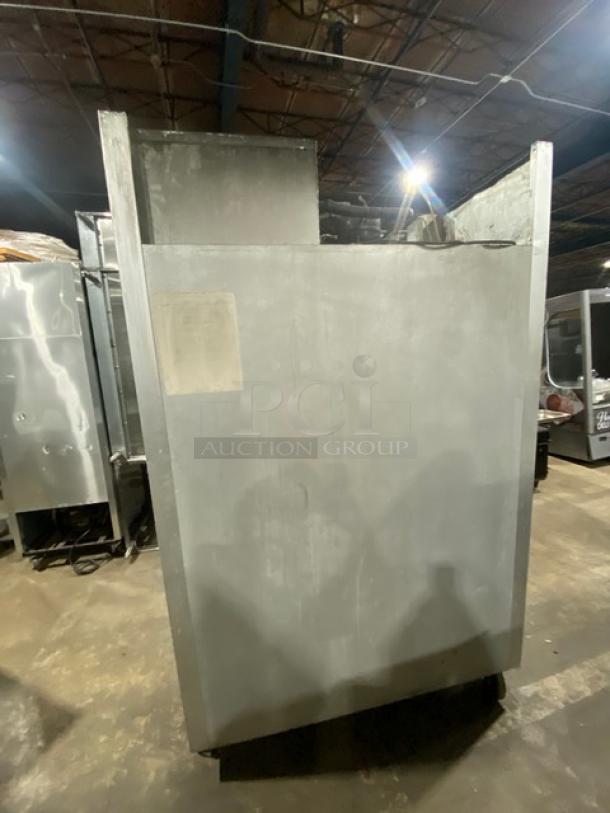 Traulsen G20010 stainless steel refrigerator, solid 2-door, Energy Star Certified, on casters, with poly-coated racks.