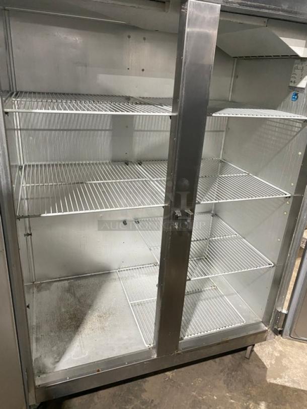 Traulsen G20010 commercial stainless steel 2-door refrigerator, Energy Star certified, with poly coated wired racks, on casters.