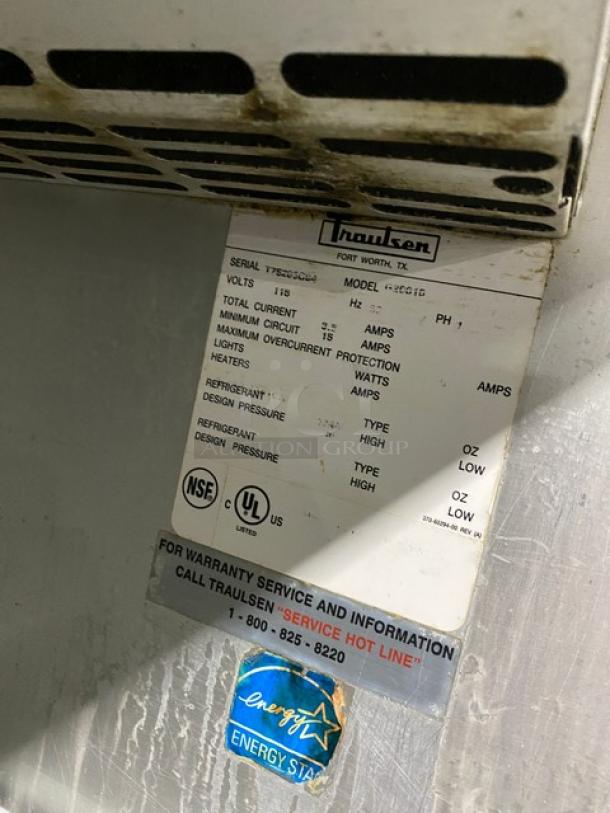 Traulsen Commercial Refrigerator, Model G20010, Energy Star Certified, on casters. Label shows voltage and service info.