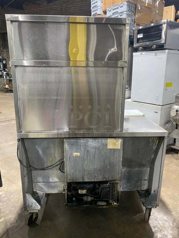 Randell stainless steel refrigerated prep table, model 93037, with double overhead shelf, on casters. Used condition.