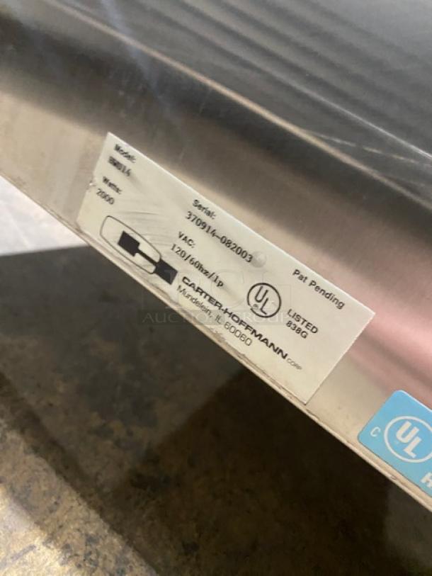 Carter-Hoffmann stainless steel heated holding cabinet, single section, half door, electric, 120V, pan slides, on casters, model info visible.